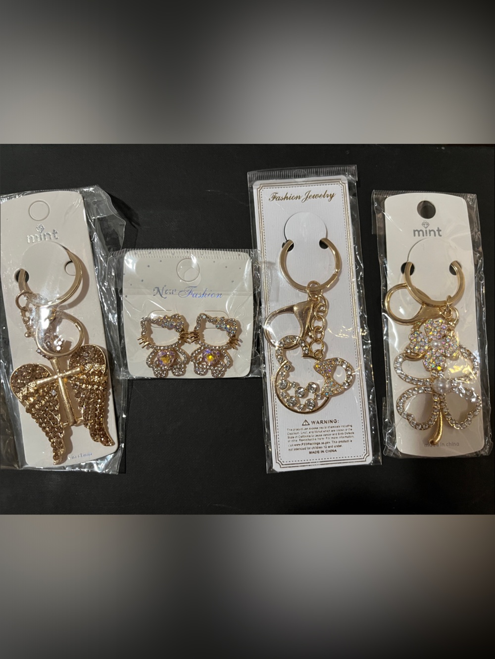 4 Bag charms/Keychains, Hello Kitty, Mickey Mouse,Clover,Wings